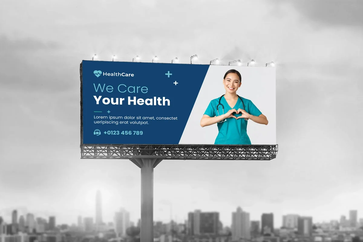 Outdoor hospital billboard featuring smiling nurse with heart gesture, used for promoting healthcare services and building patient trust through large-format medical signage